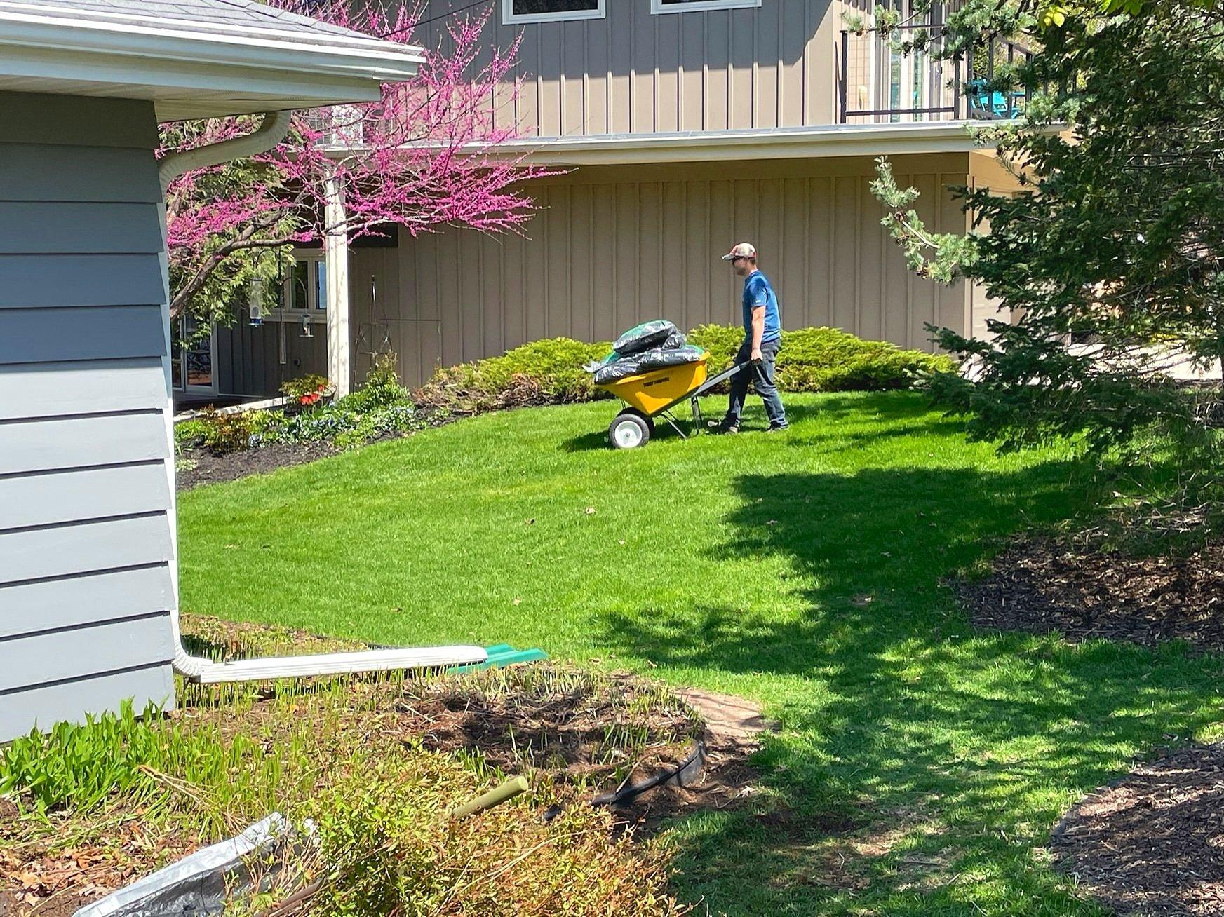 Lawn care professionals expertly mowing and maintaining a lush green lawn.